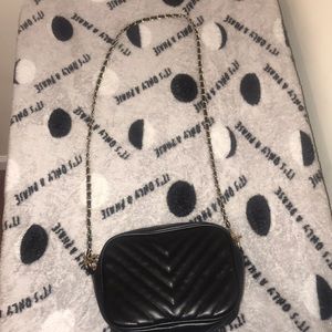 A black cross body purse